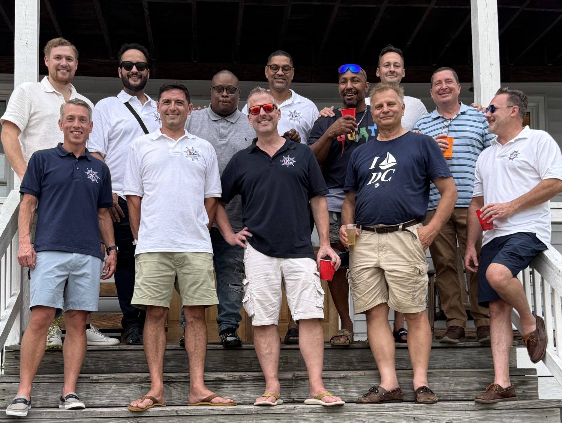 Members of the Eastern Power Boat Club gathered on the clubhouse steps for the 2025 flag raising.