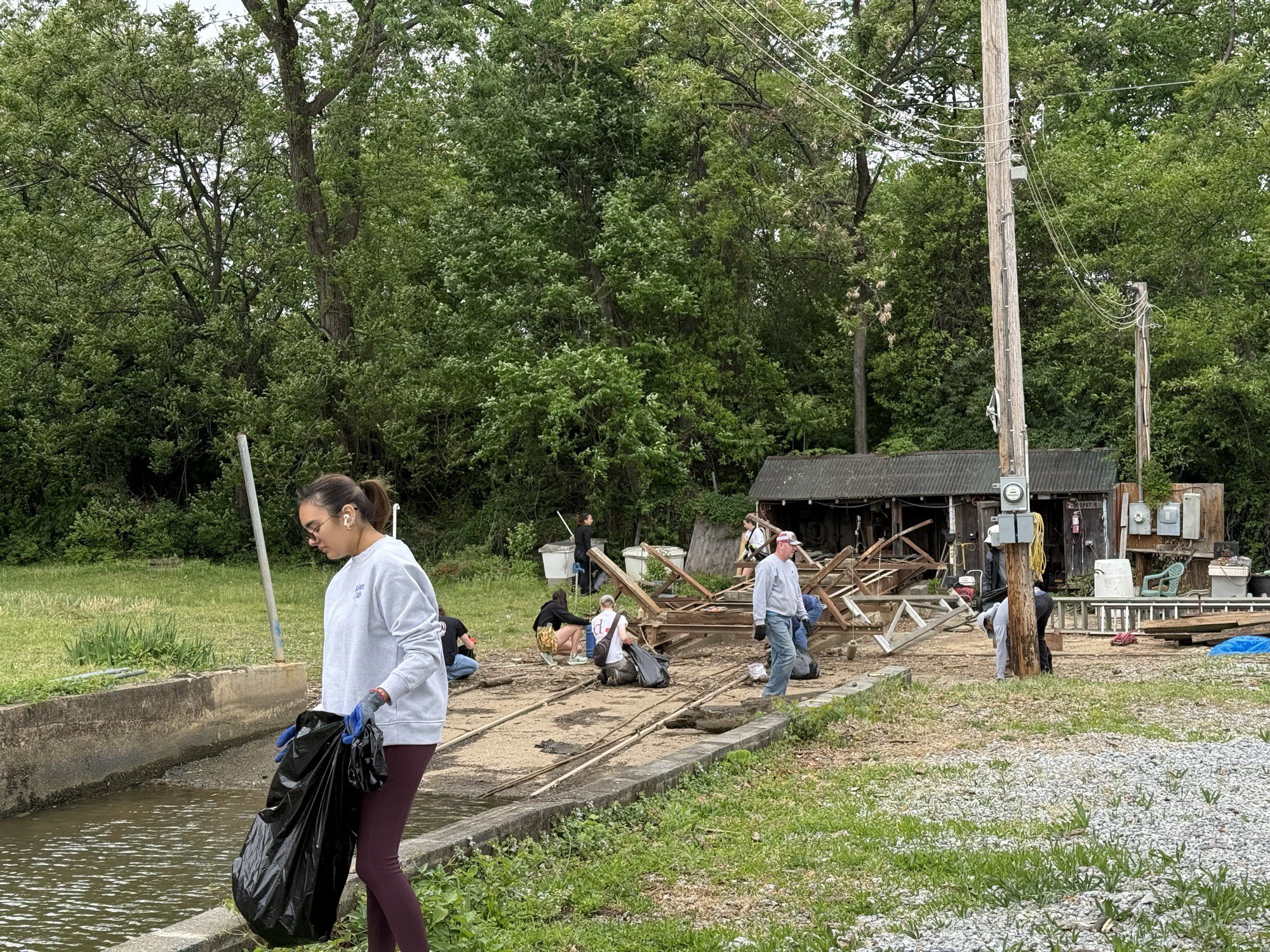Members working along the club's marine railway on the Anacostia shoreline.