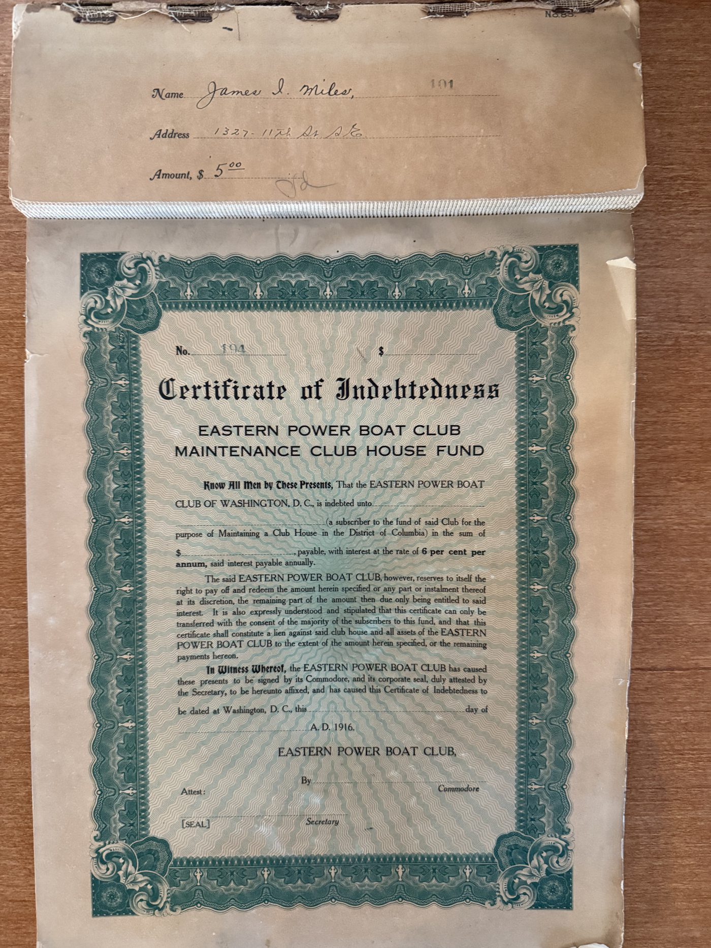 A 1916 Eastern Power Boat Club Certificate of Indebtedness for the Maintenance Club House Fund, still bound into the club’s book of certificates, its stub filled out to James I. Miles for five dollars.